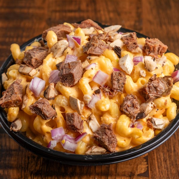 Close-up of Mix & Mac Kitchen's mac and cheese with beef, mushrooms, and red onions.